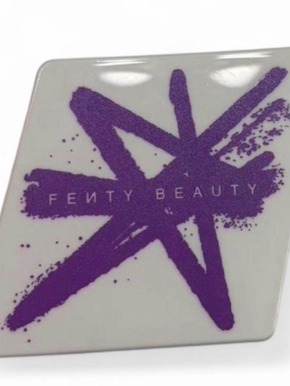 Fenty Beauty White Compact with Purple Star Graphic